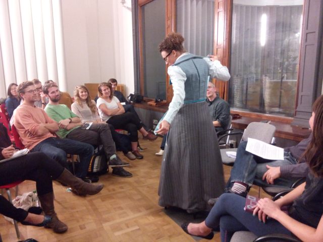 Kat Jungnickel demonstrating her cycling costume based on a design patent lodged by a woman in Bristol in 1897. 